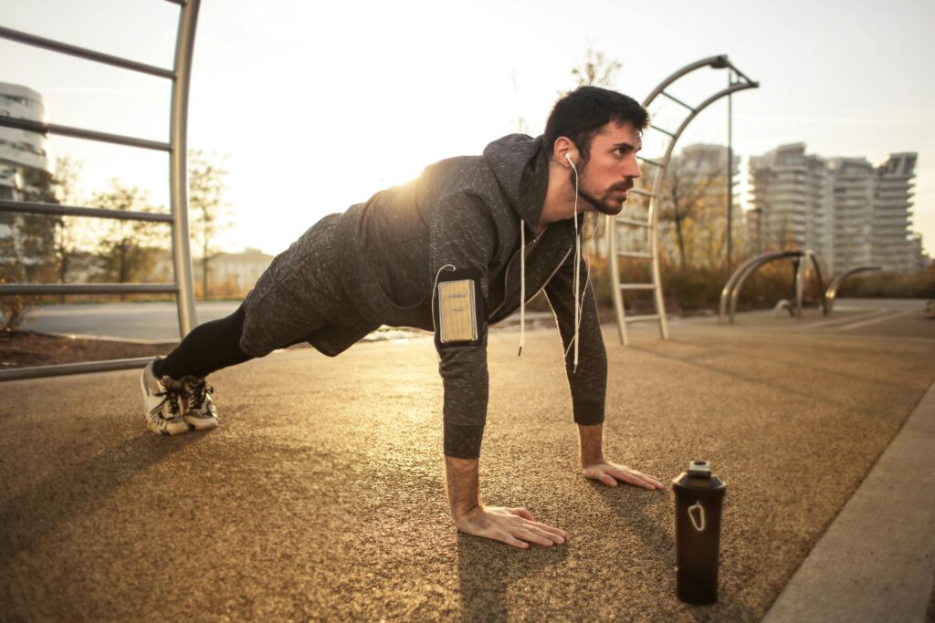 Man performing push-ups during morning exercises at home to build strength and endurance