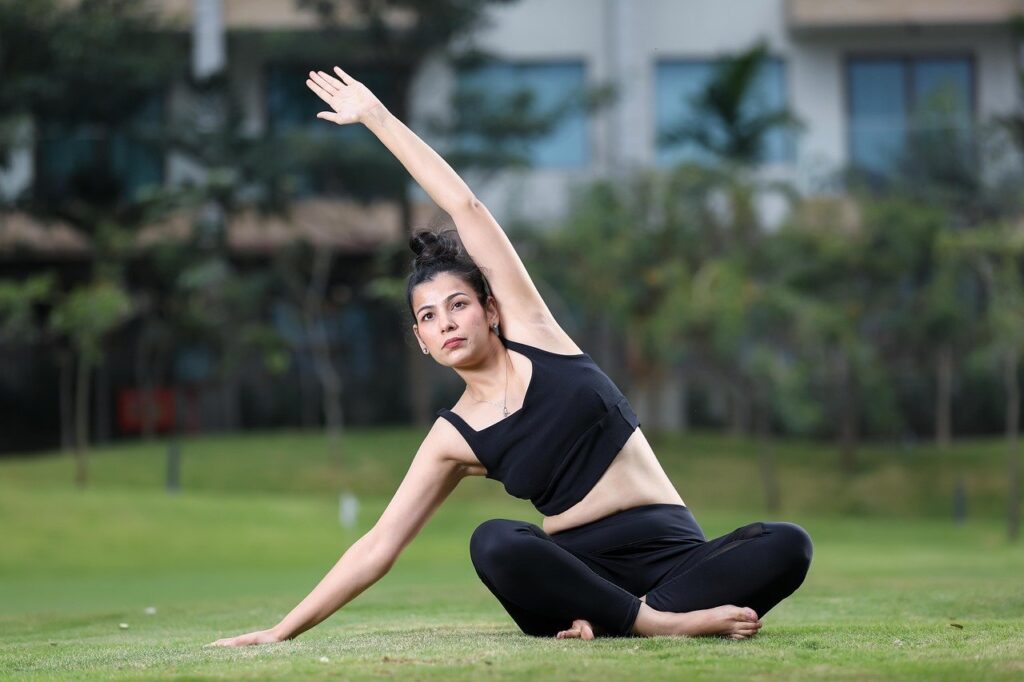 Person waking up peacefully with sunlight entering the room, stretching on the bed, symbolizing an energetic morning routine.”